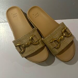 A New Day platform slides with buckle detail